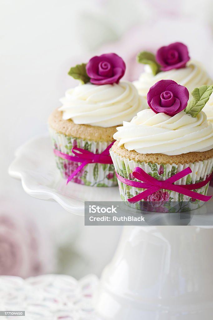 Rose cupcakes Rose cupcakes on a cakestandPlease see my portfolio for lots more cupcakes - Afternoon Tea Stock Photo