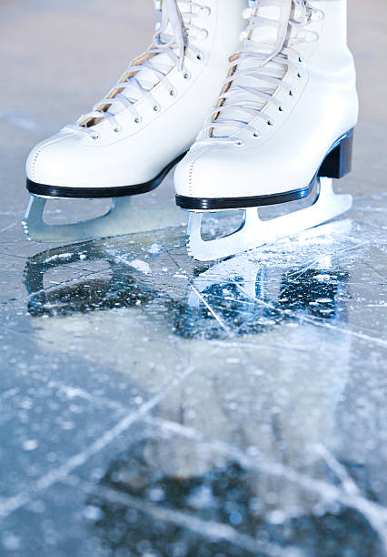 Portrait version, woman ice skates with reflection stock photo