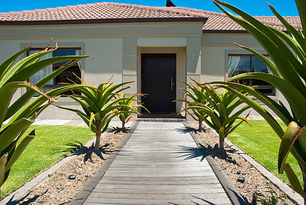 istock Walkway and front door of a house 177104875