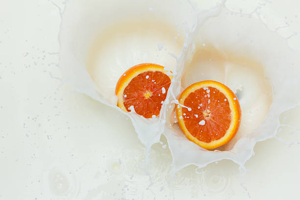 Orange and splashing milk