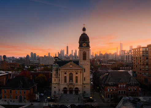 Aerial view of St. John Cantius Catholic Church with Chicago skyline in background