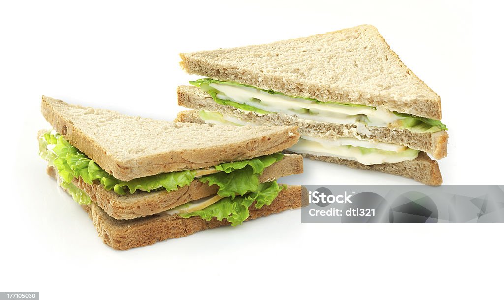 Sandwich with lettuce, cucumbers, cheese and chicken meat "Sandwich with lettuce, cucumbers, cheese and chicken meat on white background" Bread Stock Photo