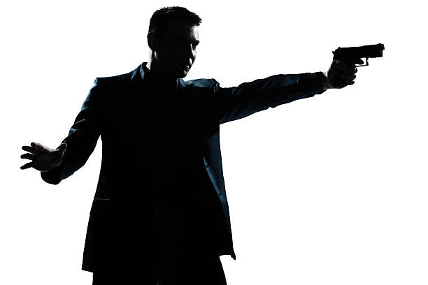 istock silhouette man portrait with gun aiming 177105731
