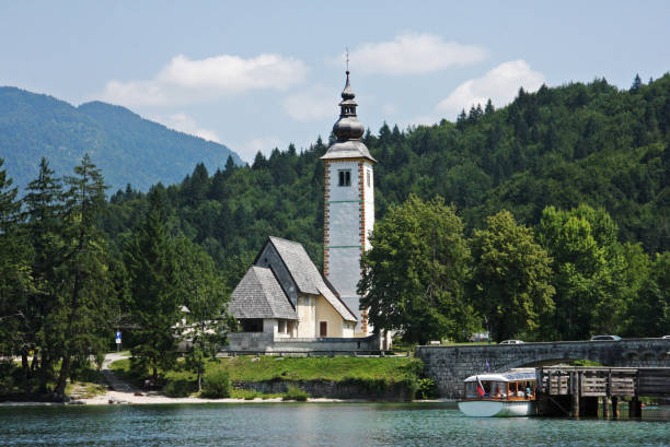 istock Church and bridge in Bohinj lake 1771058116