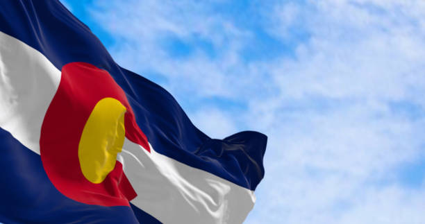 close-up of colorado state flag waving in the wind on a clear day - colorado flag imagens e fotografias de stock