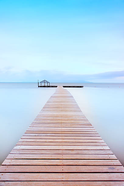 istock Wooden pier in a cold atmosphere. Tuscan coast. 177106292
