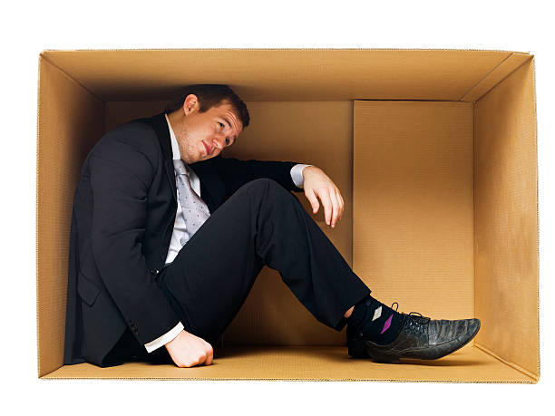 istock Businessman in a tight cardboard 177106396