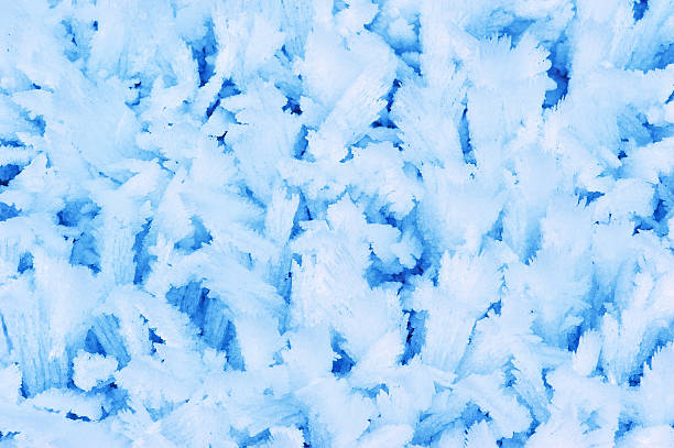 Blue frost crystals pattern. Close-up shot. stock photo