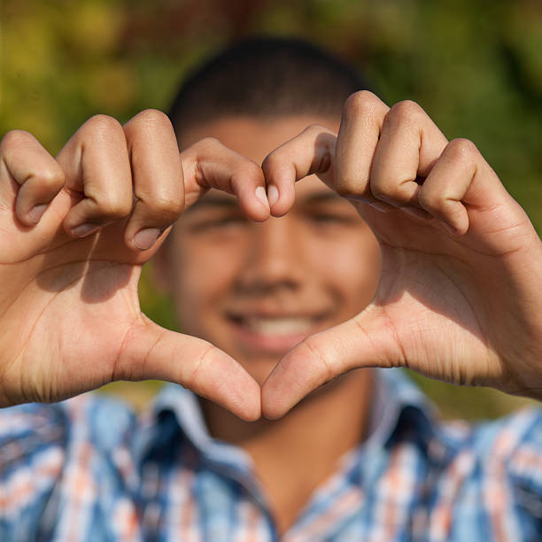 istock Young man show love sign 177108323