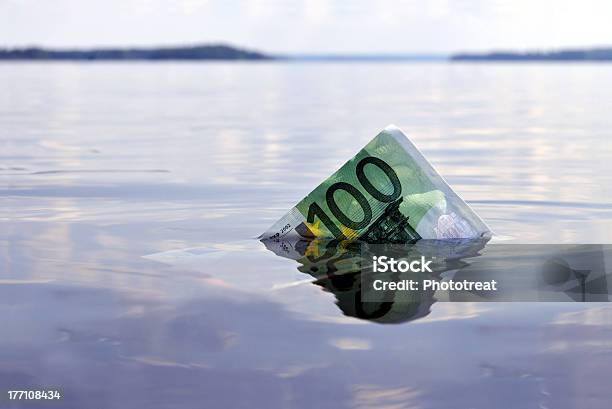 Hundred Euros Sinking Stock Photo - Download Image Now - Sinking, Currency, European Central Bank