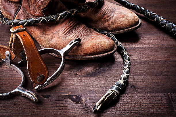 istock Cowboy boots,whip and spurs on wood 177108439
