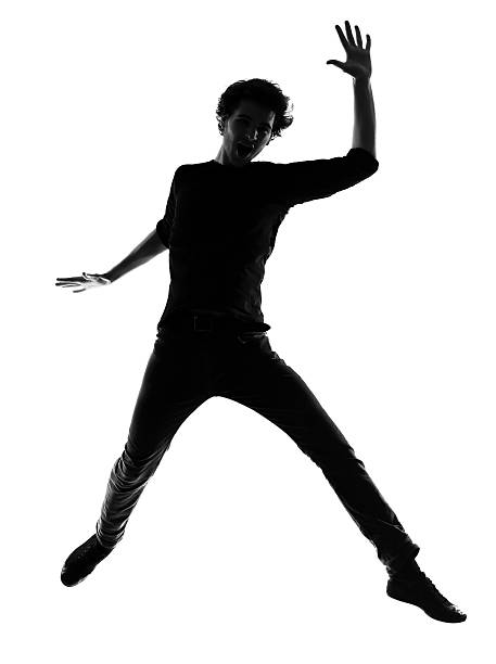 istock young man silhouette jumping happy 177108443