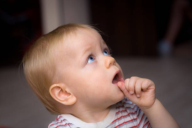 istock Amazed baby suck thumb 177108780