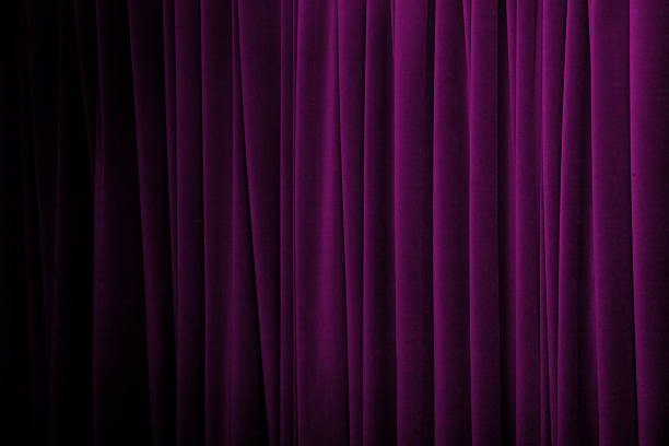 Close-up of purple curtain in various tones Purple curtains with many folds and dark gradually from the left side. velvet curtain stock pictures, royalty-free photos & images