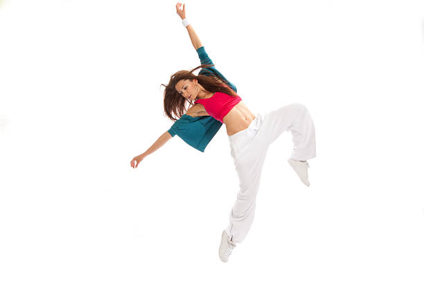 Pretty modern slim hip-hop new style woman dancer break dancing on a white studio background