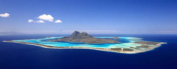 "Full View of Bora Bora Lagoon, French Polynesia from above on a near cloudless day. Prime honeymoon destination"