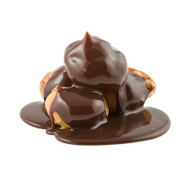 flowing down chocolate on Profiteroles
