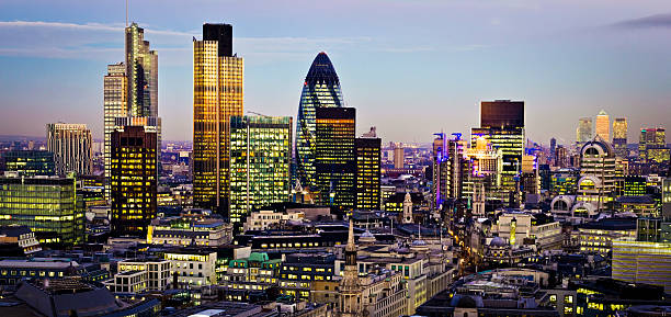 Aerial view of London at night "City of London one of the leading centres of global finance.This view includes Tower 42 Gherkin,Willis Building, Stock Exchange Tower and Lloyd`s of London and Canary Wharf at the background." lloyds of london photos stock pictures, royalty-free photos & images