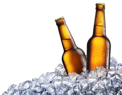Two bottles of beer on ice. Isolated on white background.