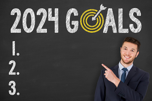 New Year 2024 Goals on Chalkboard Background