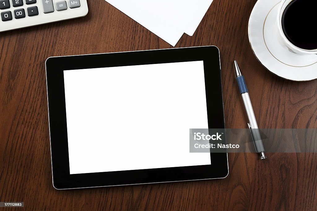 Blank PC tablet with clipping path Blank digital tablet at the desk with clipping path for the screen Press Room Stock Photo