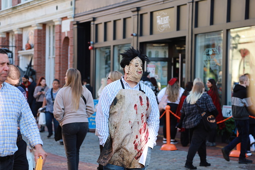 Salem, MA, US. October 31, 2023: People visiting the annual Haunted Happenings event held during the month of October in celebration of the town's history of witch trials and Halloween.