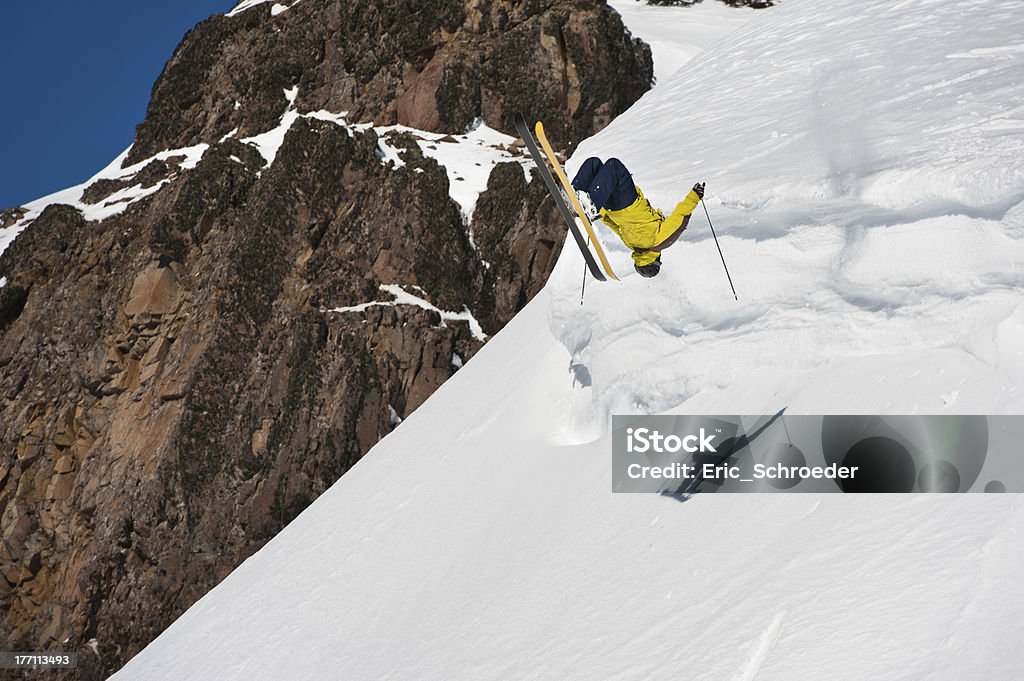 Back in the air of a skier Skier turning on the air in snow cornices. Alpine Skiing Stock Photo