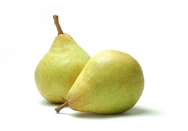 comice pears su sfondo bianco - two pears foto e immagini stock