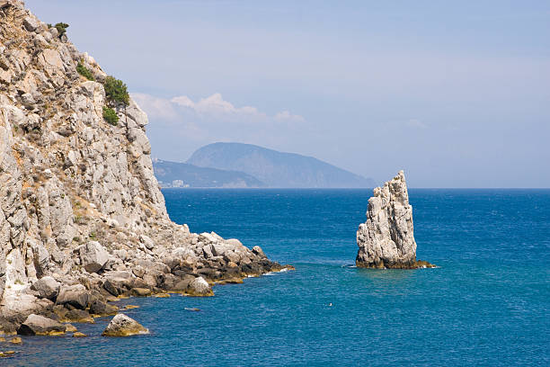 istock rocks in the sea 177114240
