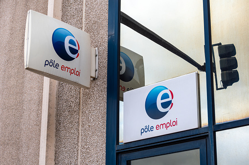 Saint-Denis, France - October 31, 2023: Signs outside a Pôle Emploi agency (French employment center). Concepts of unemployment, layoffs and redundancy in France