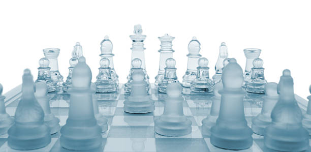 Glass chess. The first move. stock photo