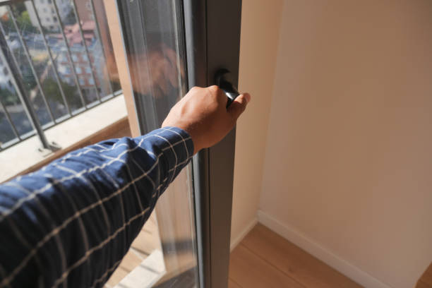 istock hand open gray plastic pvc window at home at early morning 1771176106