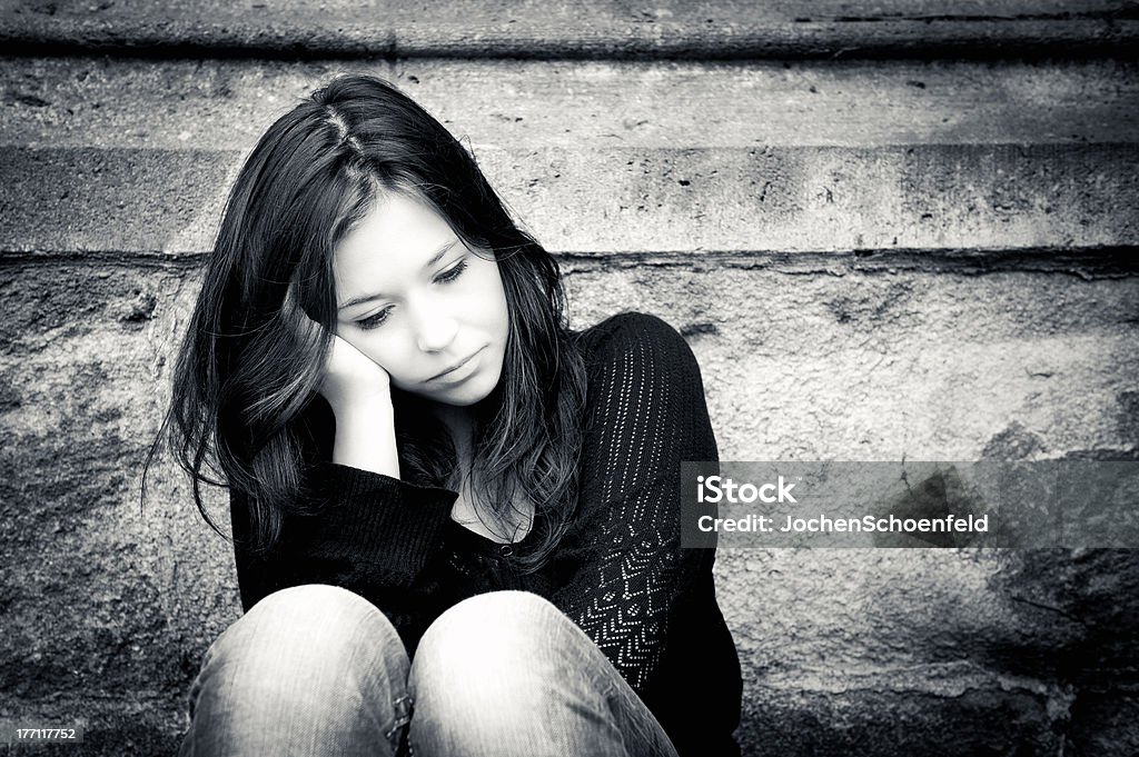 Teenage girl looking thoughtful about troubles Outdoor portrait of a sad teenage girl looking thoughtful about troubles 18-19 Years Stock Photo