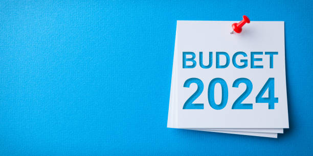 istock Budget 2024 Word in White Sticky Note on Blue Chardboard Background 1771179359