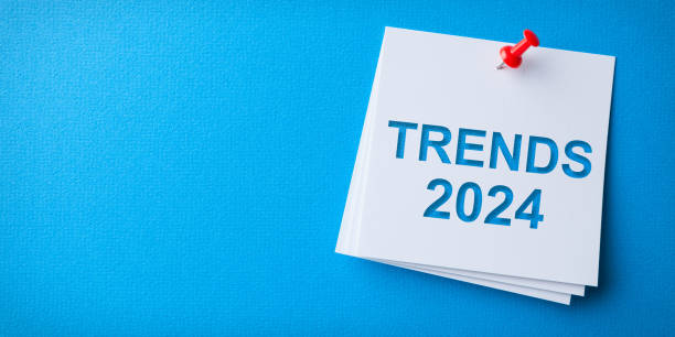 istock Trends 2024 Word in White Sticky Note on Blue Cardboard Background 1771179360