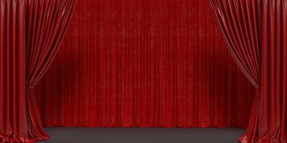 Large red curtain with spot light in the middle.