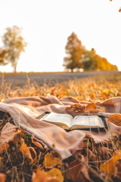 istock Open Bible on a blanket, autumn 1771183688