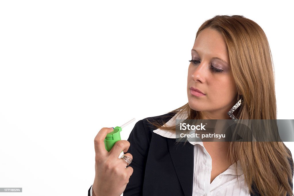 businesswoman with asthma using inhaler businesswoman with a pump for asthma Adult Stock Photo
