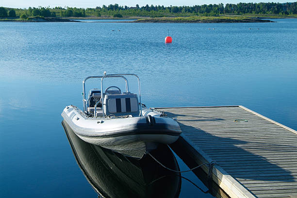 Rigid inflatable boat at a pier stock photo