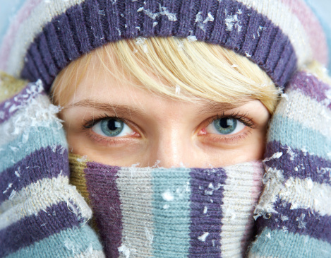 portrait of a young woman in winter clothes close-up