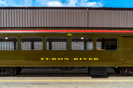 Antonito, CO - August 23, 2021: A vintage passenger car is backed out of the rail yard during a public steam up in the Cumbres and Toltec Railroad yard at Antonito, Colorado.