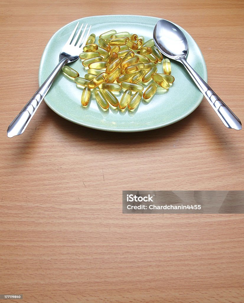 Molti giallo vitamina su un piatto - Foto stock royalty-free di Alimentazione sana