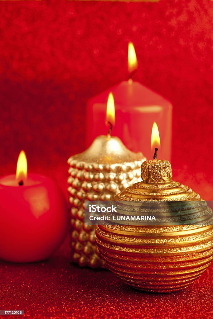 christmas candles group on red glitter christmas candles group on red glitter background Candlelight Stock Photo