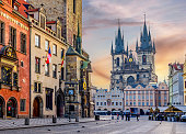 City Hall with Astronomical clock and Church of Our Lady before Tyn on Old town square at sunrise, Prague, Czech Republic