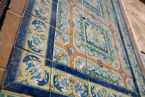 Old, ornate tiling in a facade