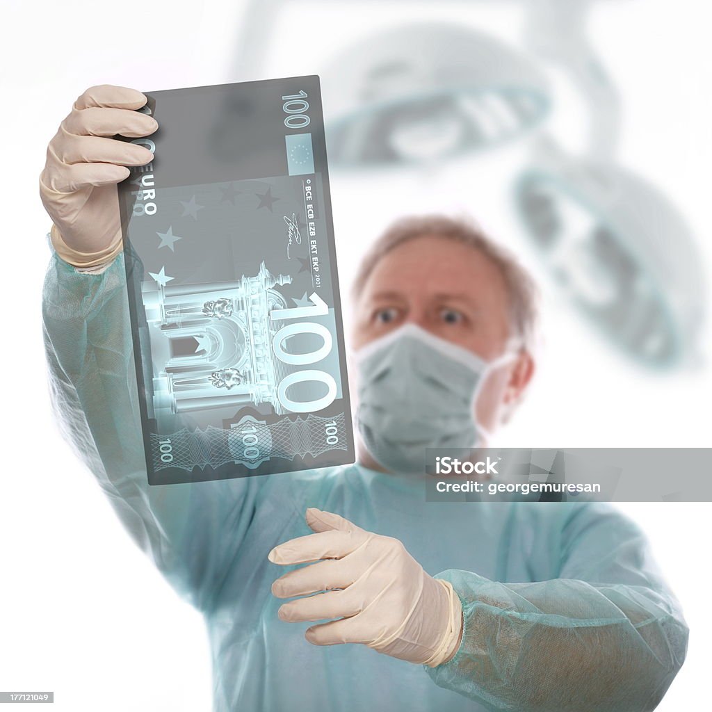 Euro sickness Specialist reviewing euro x-ray before taking last decision. Medical X-ray Stock Photo