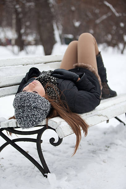 istock Girl on a bench in the winter 177121269