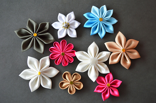 Handmade fabric flowers. Hobby and craft concept. Flat lay.