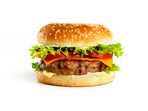 Delicious juicy grilled burger on wheat buns. Studio macro shot isolated on white background