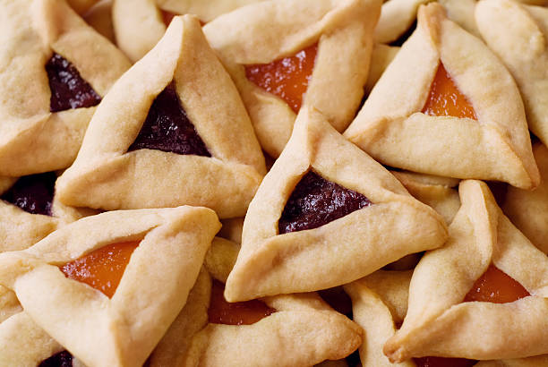 Close up of a pile of Hamantaschen Cookies Traditional hamantaschen cookies for the Jewish festival of Purim. judaism photos stock pictures, royalty-free photos & images